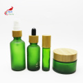 green custom cream glass jar glass pump spray lotion oil toner bottle with bamboo cap BJ-245B